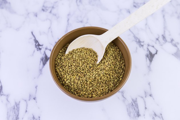Fenugreek (Yellow tea, Methi, Shambala) seeds on white background