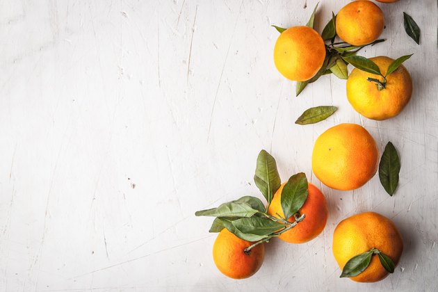 Mandarins at the right on the white wooden table horizontal