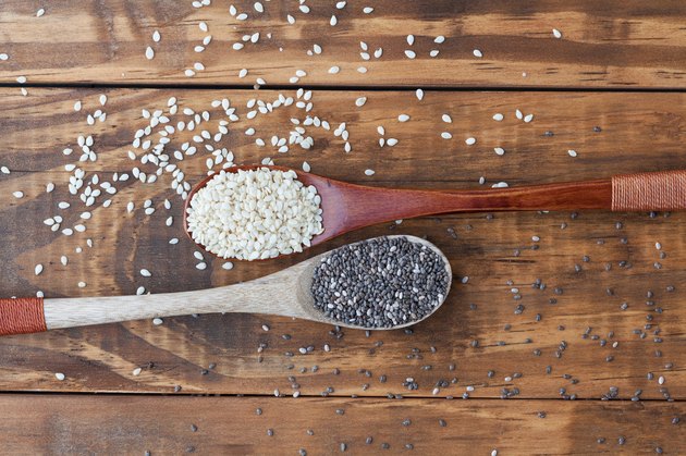Directly Above Shot Of Seeds With Spoons On Table