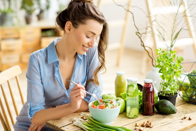 Woman eating healthy salad for daniel fast