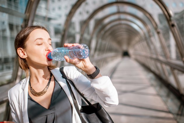 Business woman with water at the business center