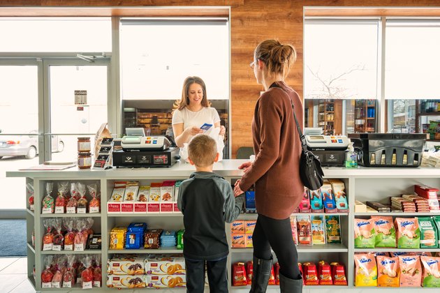 Mother with son shopping in a delicatessen store