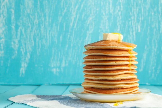 Stack of pancake with honey and butter on top