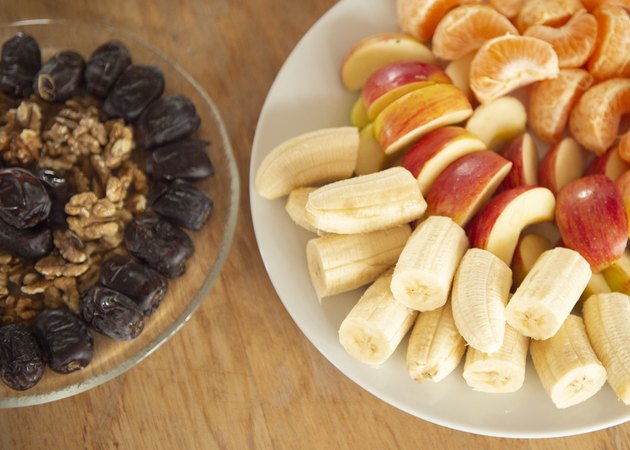 Mixed fruit and nuts on a table.
