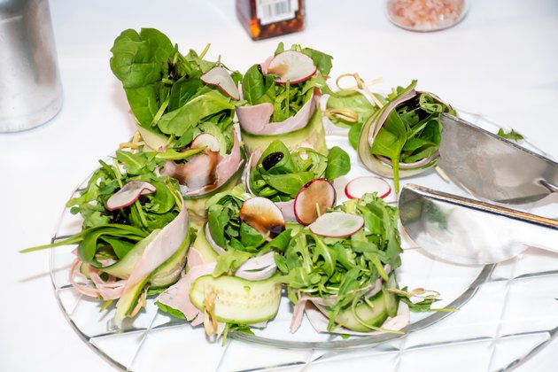Fresh dark leafy greens salad lettuce mix with cucumbers,