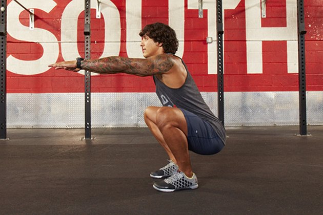 Man performing CrossFit body-weight air squat.