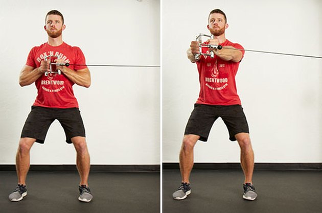 Man performing anti-rotation press on the cable machine