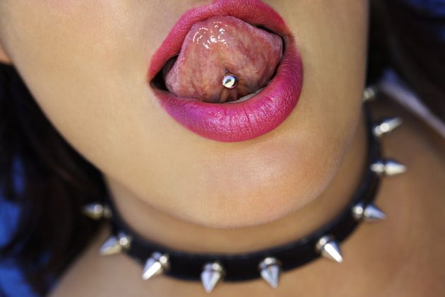 Woman showing pierced tongue