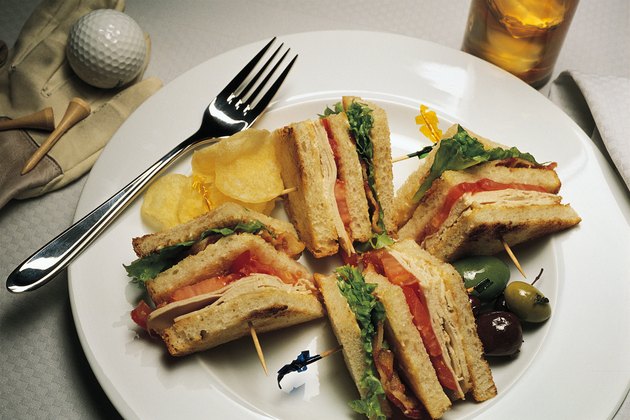 Clubhouse sandwich with golf ball and tee
