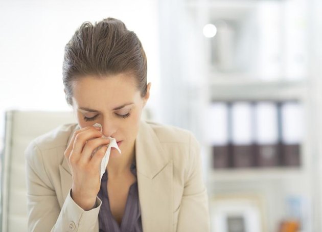 A young businesswoman, allergies