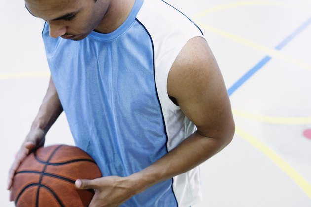 High angle view of a young man holding a basketball