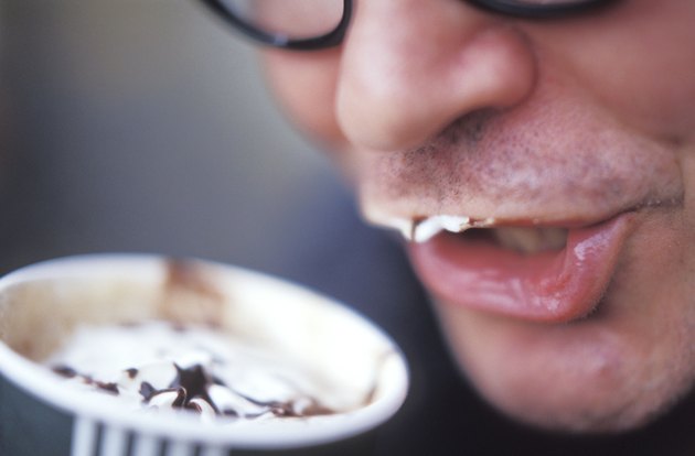 Man Drinking a Creamy Coffee Drink