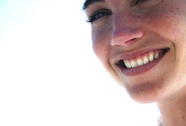 Beautiful woman with blue eyes smiles