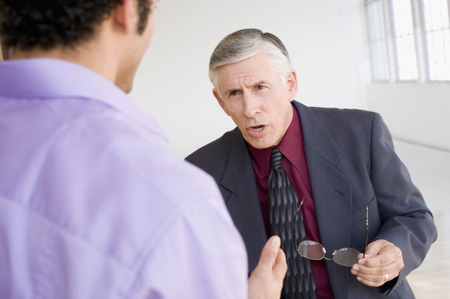 Two businessmen arguing with each other