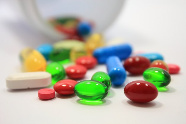 Pills spilling out of pill bottle