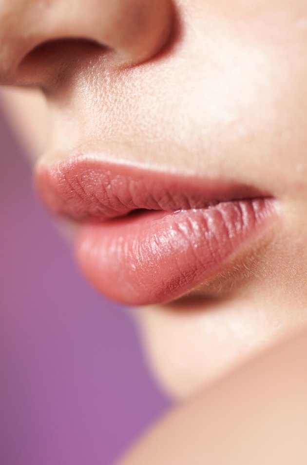 a close up shot of the full lips of a young caucasian girl