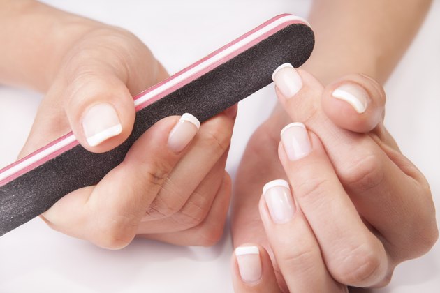 woman filing nails