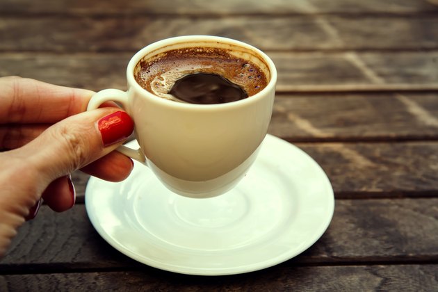 woman's hand holding cup of Turkish coffee "espresso" Istanbul, Turkey