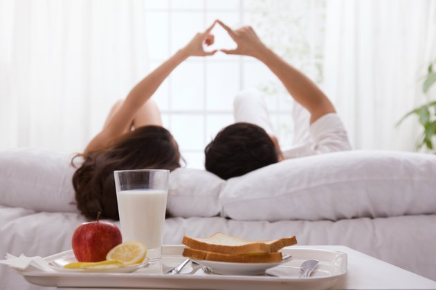 Young couple lying on bed