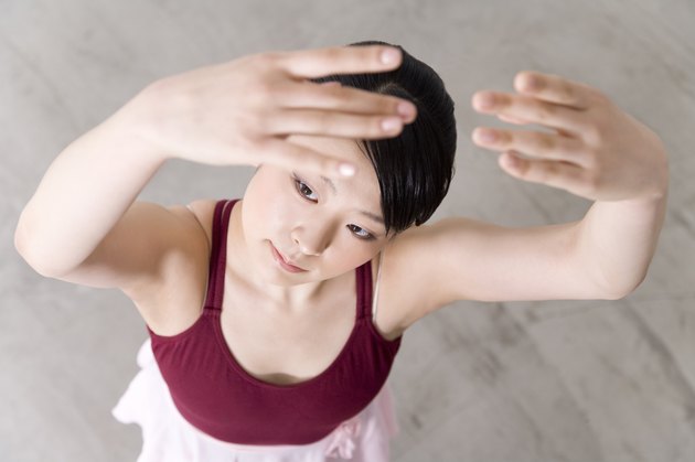 Ballerina posing on floor
