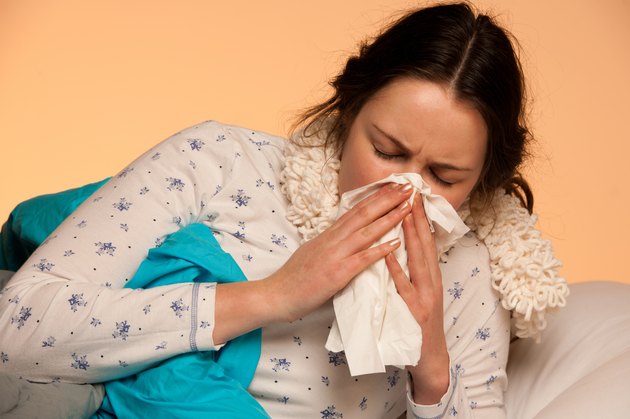 Asian caucasian woman with flu and fever