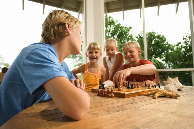 Girls Watch While Boys Play Chess