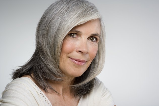 Mature woman smiling, portrait, close-up
