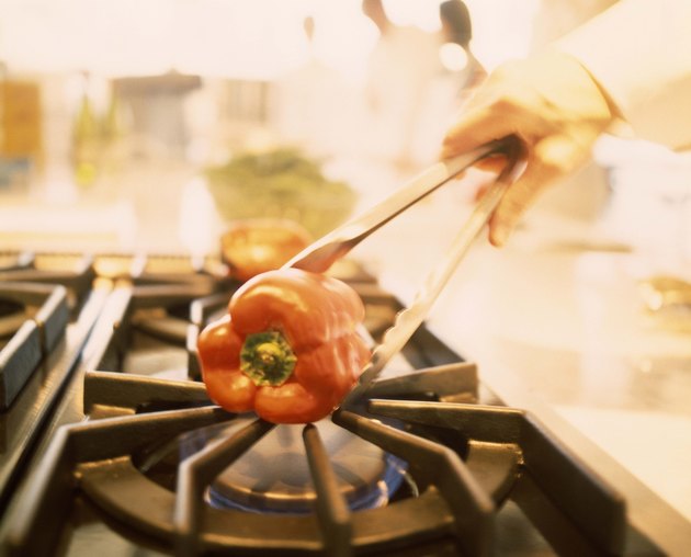 Charring bell pepper over gas flame