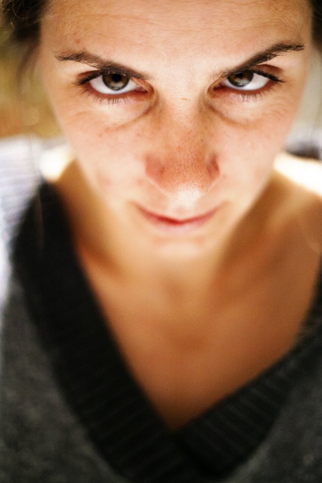 Female looking with squint eyes into the camera