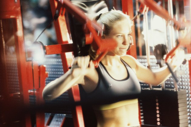Close-up of a young woman exercising in a gym