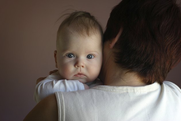 grandmother holding baby girl