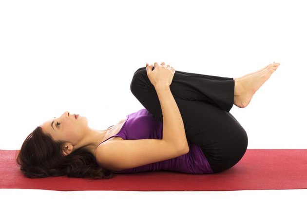 Young woman relaxing during yoga (Series with the same model available)