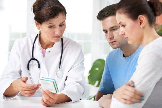 Doctor consults a young couple