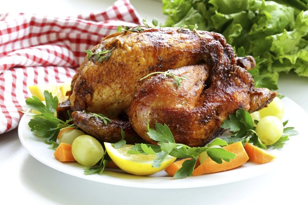 roasted chicken with herbs served vegetables and grapes