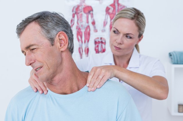 Doctor stretching her patient neck