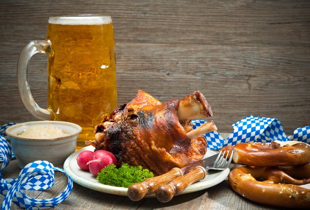 Roasted pork knuckle with pretzels and beer.