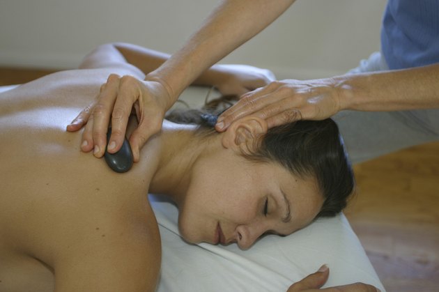Young woman getting a neck massage