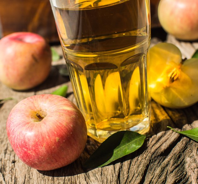 Apple juice on a wooden board
