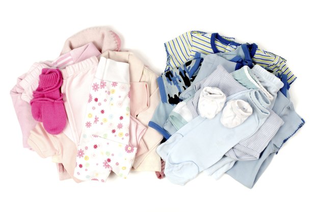 Close up with blue,pink stack of clean baby clothes