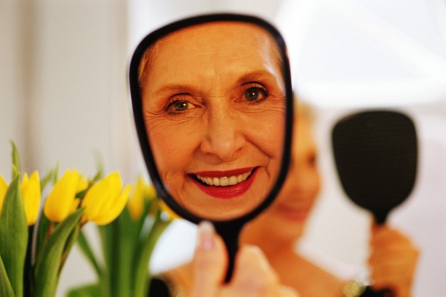 Woman's reflection in mirror