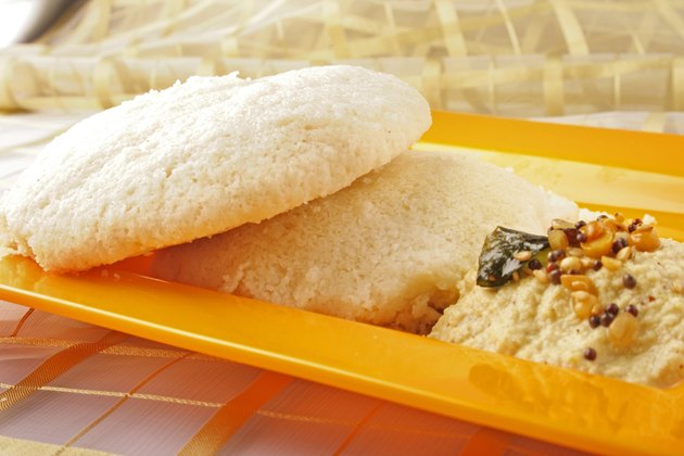 Idly served in a plate with chutney