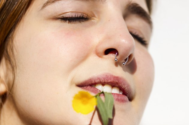 Small flower in her mouth