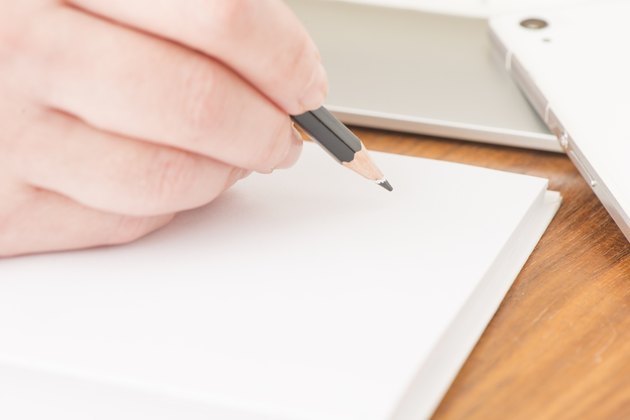 Writing in notebook