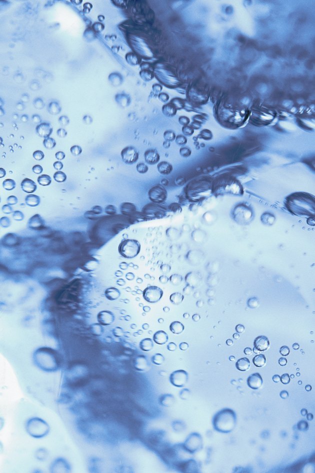 Close-up of ice cubes in soda water
