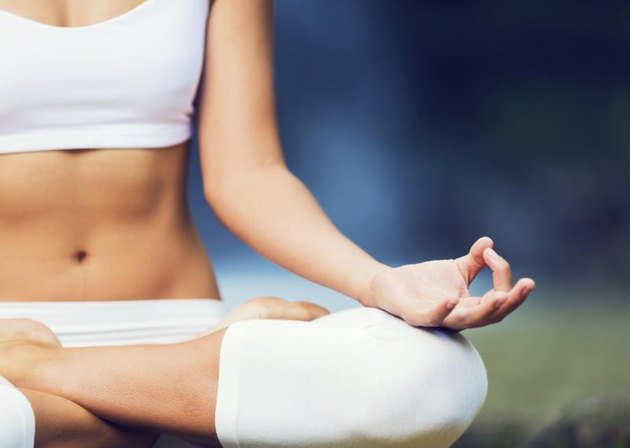 Beautiful Woman Practicing Yoga Outside In Nature, Healthy Lifestyle Wellness Concept, Shallow Depth of Field
