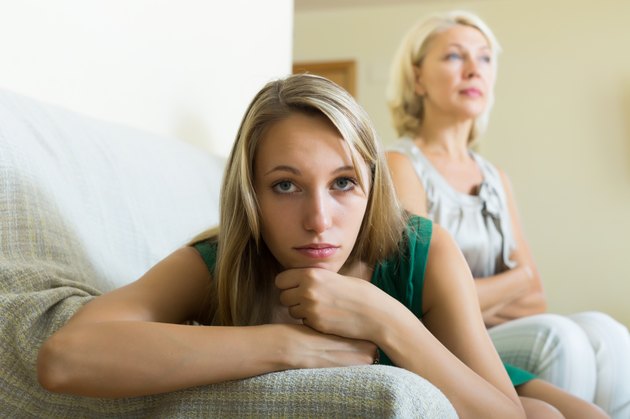 Upset woman and mother having conflict
