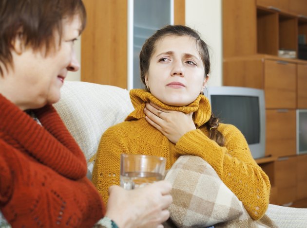 Mature woman caring for sick adult daughter