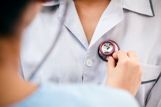 doctor listening to patient’s heart