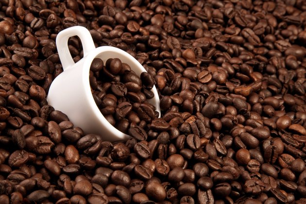 white cup with coffee beans
