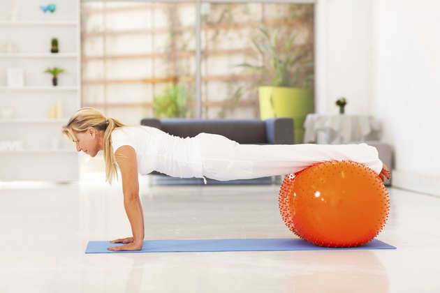 middle aged woman doing push ups